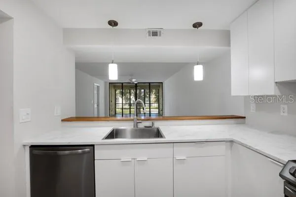 a kitchen with a sink and a window