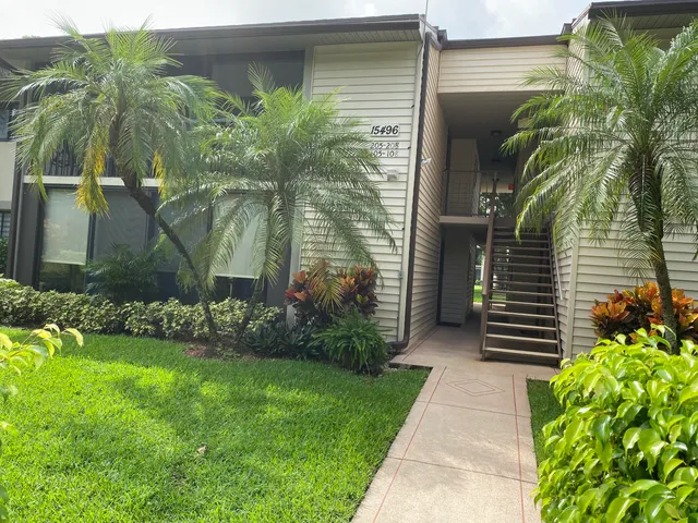 a view of a swimming pool with a yard