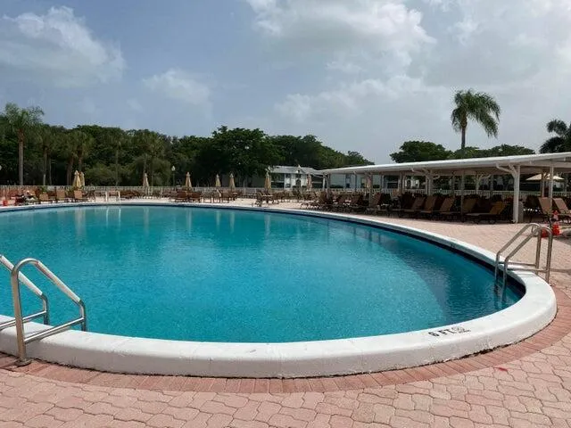 a view of a patio with a table and chairs