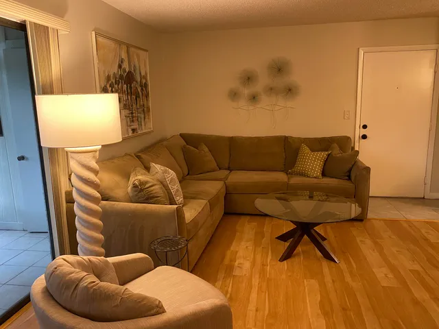 a living room with a couch and a table