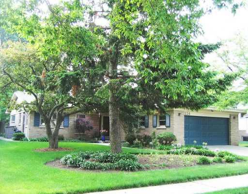224 Locust Road Wilmette, IL 60091 - Photo 1 of 1 a front view of a house with a yard and tree