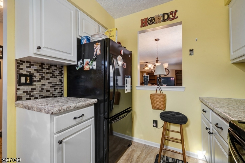 8 Lee Court Lebanon, NJ 08833 - Photo 12 of 20 a kitchen with a refrigerator and a stove