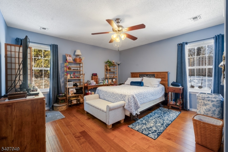 8 Lee Court Lebanon, NJ 08833 - Photo 15 of 20 a bedroom with a bed couch and a window