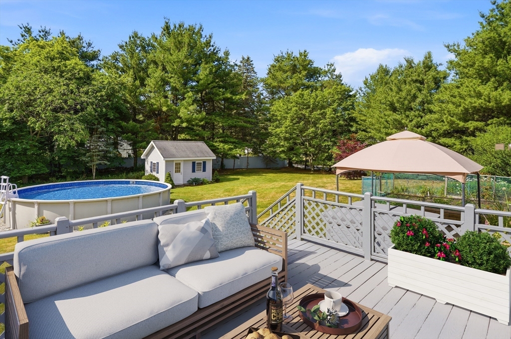 160 Navillus Road Tewksbury, MA 01876 - Photo 2 of 40 a terrace of a house with outdoor seating
