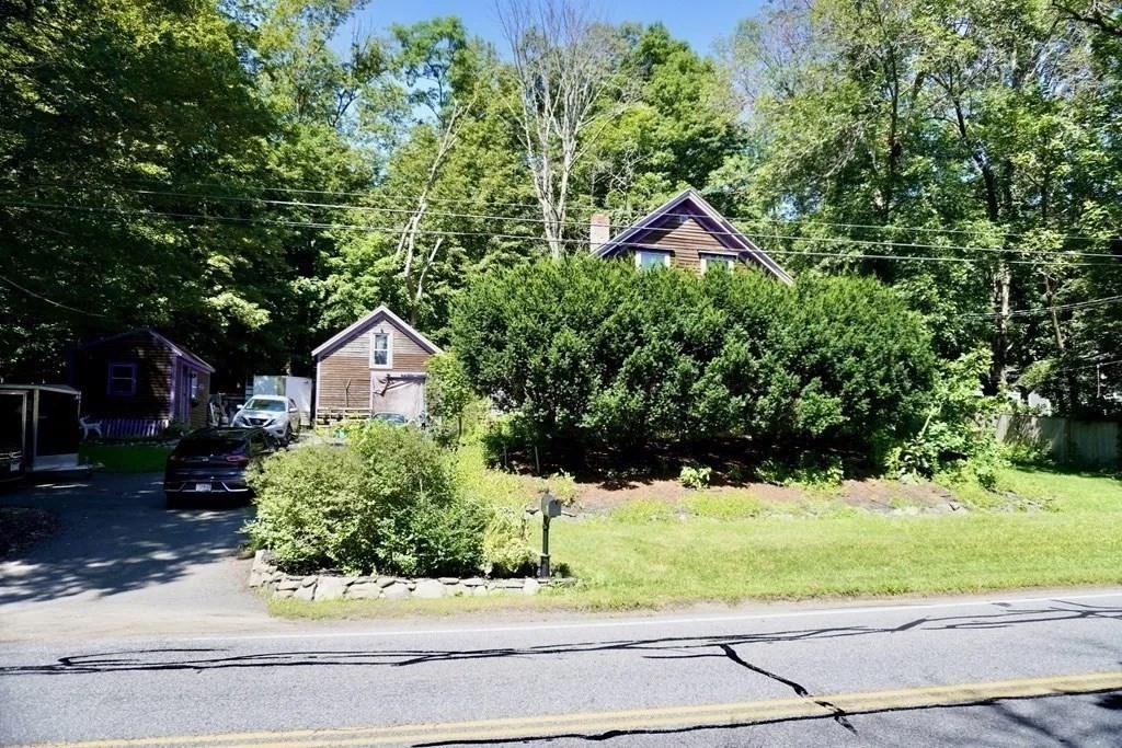 2 River Road Merrimac, MA 01860 - Photo 4 of 6 a house view with a yard and large trees