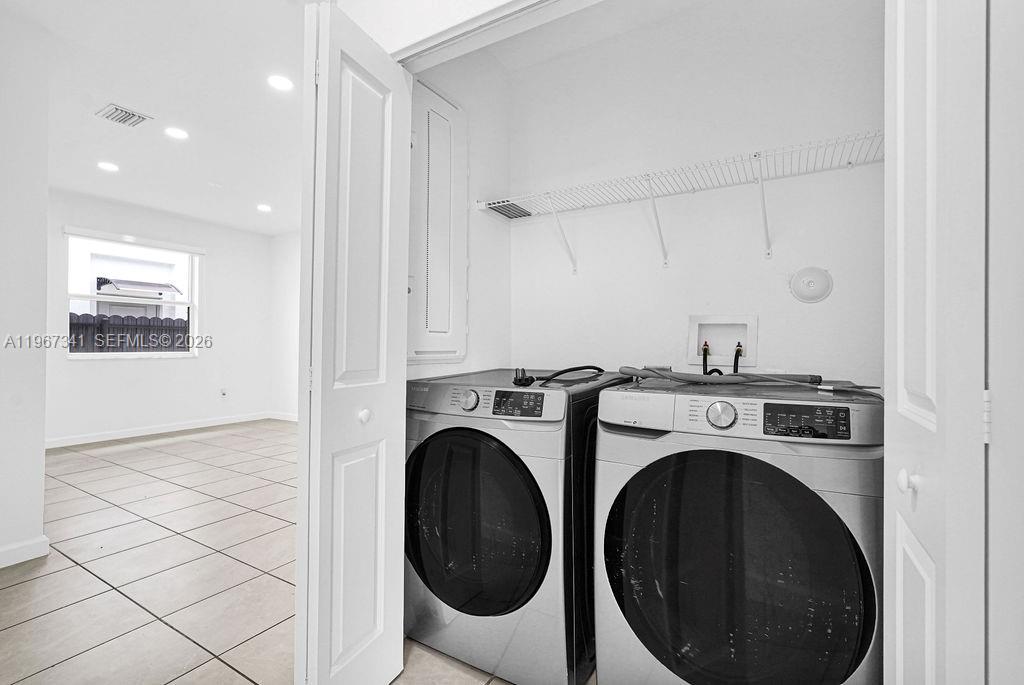 12735 Southwest 211th Street Miami, FL 33177 - Photo 14 of 34 a view of a storage & utility room with wooden floor