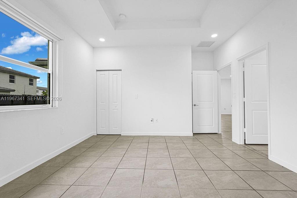 12735 Southwest 211th Street Miami, FL 33177 - Photo 25 of 34 a view of an empty room