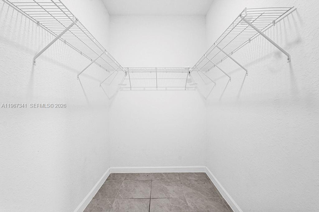 12735 Southwest 211th Street Miami, FL 33177 - Photo 27 of 34 a view of a room with racks on the wall