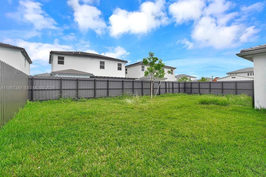 12735 Southwest 211th Street Miami, FL 33177 - Photo 31 of 34 a view of a backyard with a garden