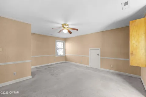 a view of an empty room and window