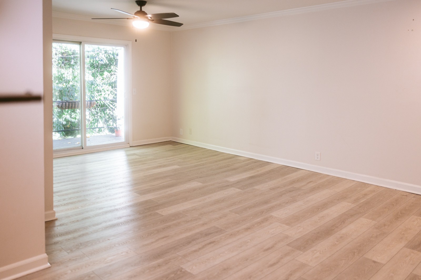 601 Boyd Mill Avenue, Unit G2 Franklin, TN 37064 - Photo 11 of 30 a view of an empty room with wooden floor and a window