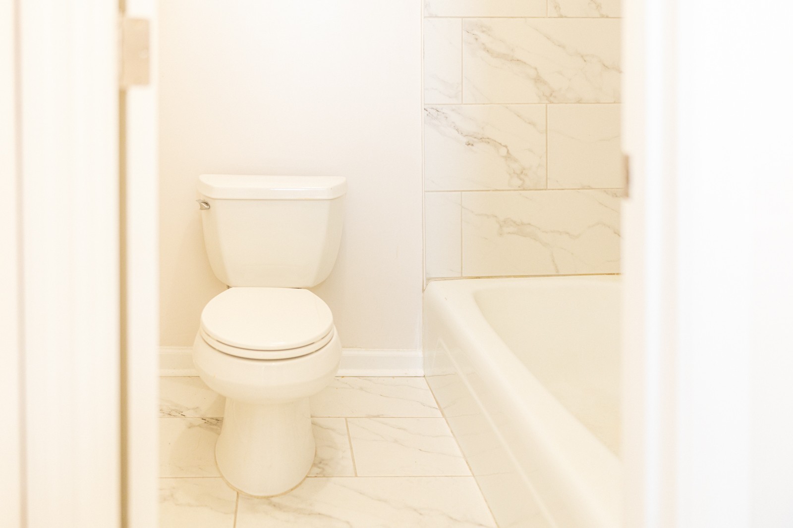 601 Boyd Mill Avenue, Unit G2 Franklin, TN 37064 - Photo 13 of 30 a white toilet sitting next to a white sink