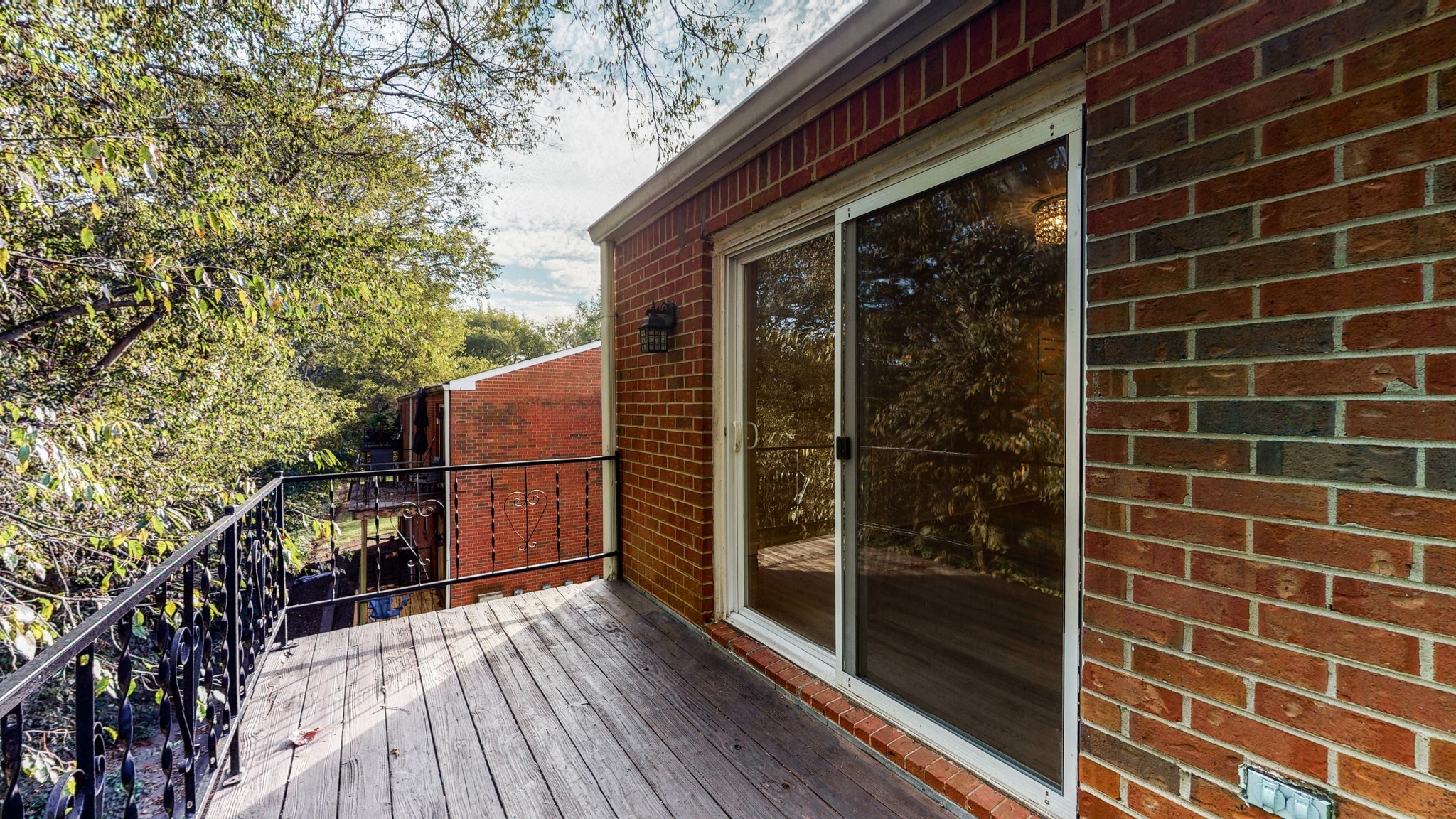 601 Boyd Mill Avenue, Unit G2 Franklin, TN 37064 - Photo 26 of 30 a view of a balcony with wooden floor and fence