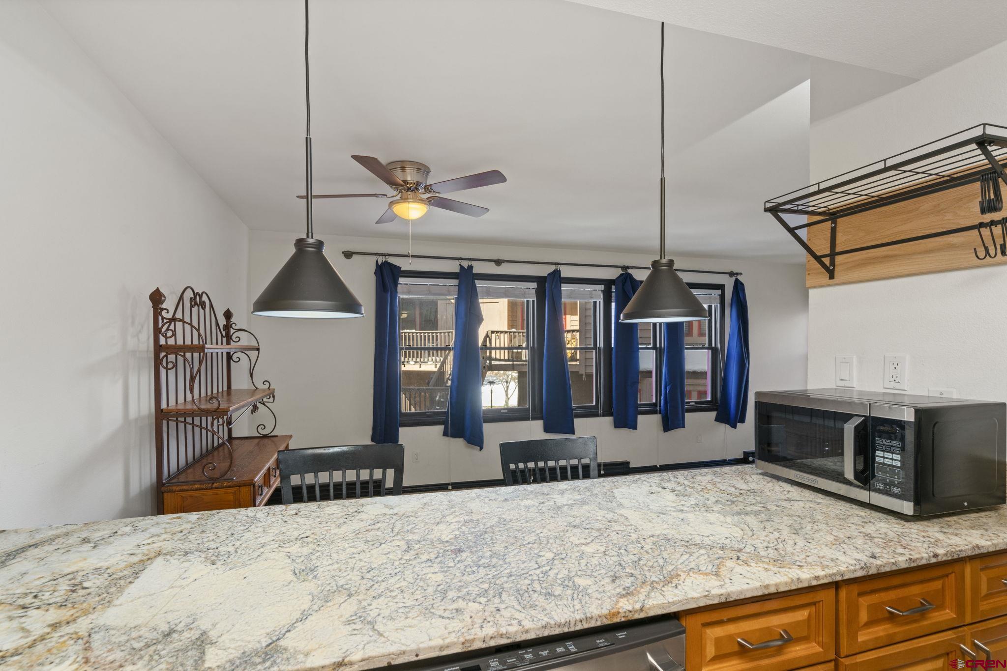 6 Ferringway Circle, Unit 44 Durango, CO 81301 - Photo 5 of 32 a living room with fireplace furniture and a window
