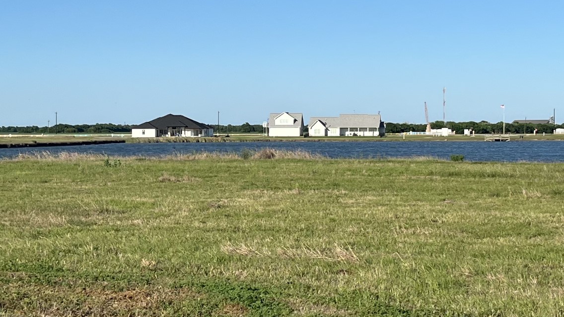 Lot 90 Sand Swept Point Port Port Lavaca, TX 77979 - Photo 3 of 10 a view of an ocean with beach
