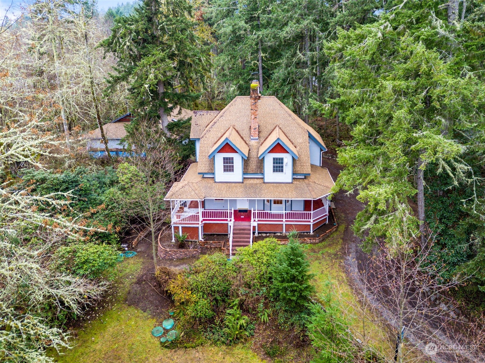 8120 Libby Road Northeast Olympia, WA 98506 - Photo 1 of 36 an aerial view of a house with swimming pool and garden