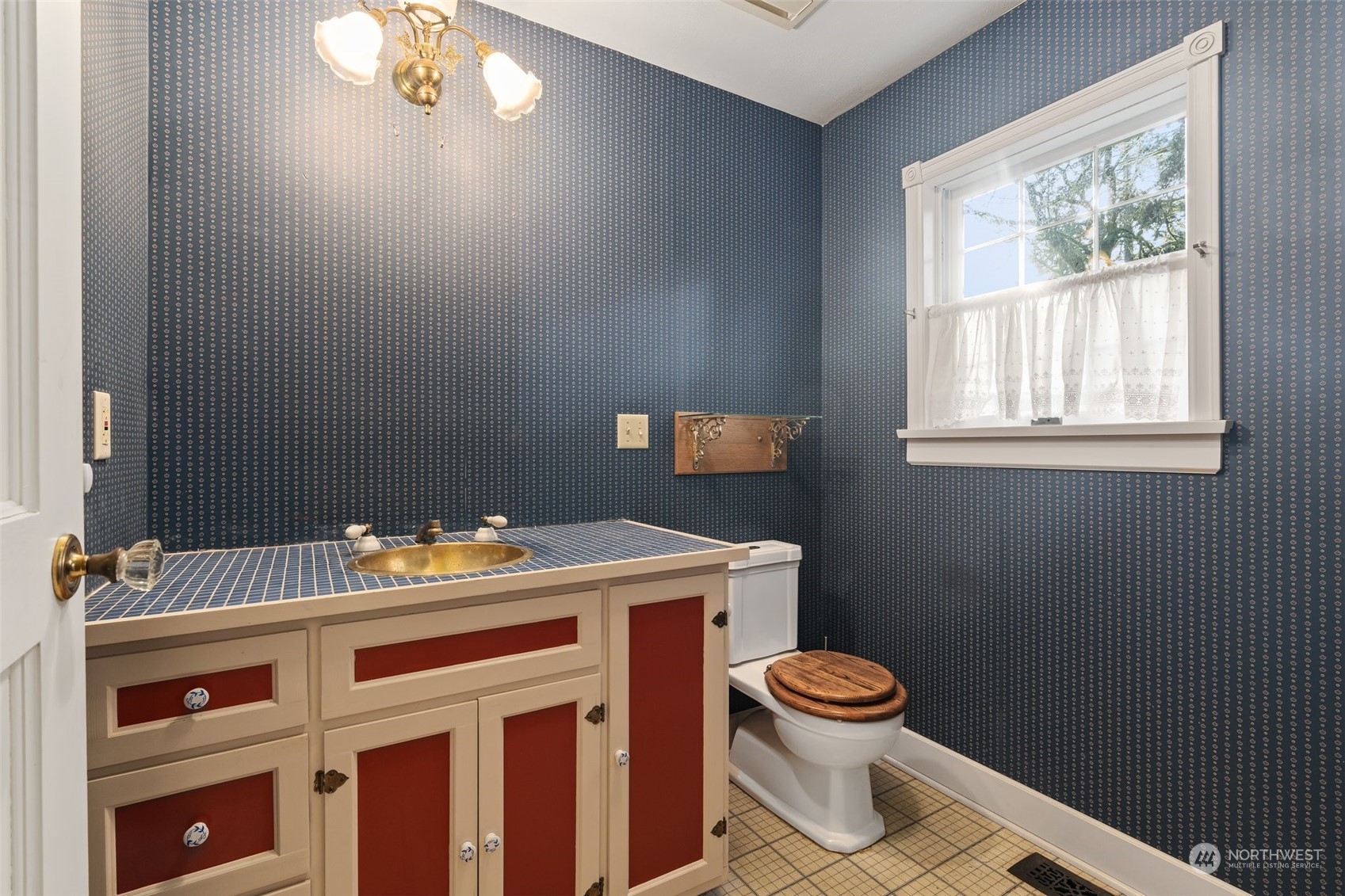 8120 Libby Road Northeast Olympia, WA 98506 - Photo 12 of 36 a bathroom with a sink a toilet and a window