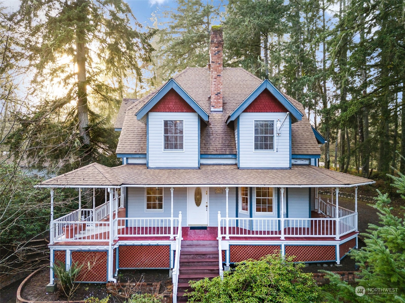 8120 Libby Road Northeast Olympia, WA 98506 - Photo 2 of 36 a front view of a house with a garden