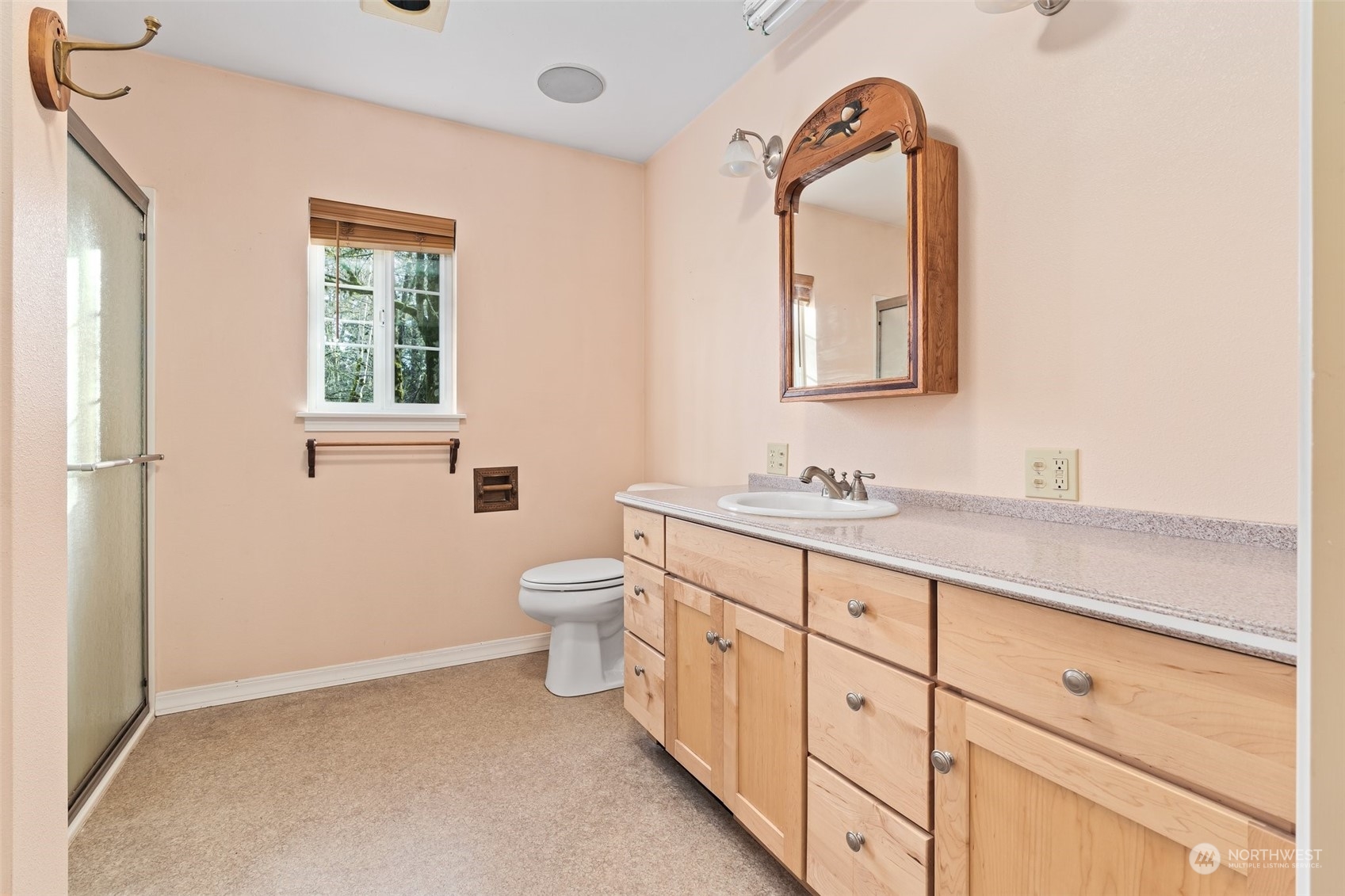 8120 Libby Road Northeast Olympia, WA 98506 - Photo 27 of 36 a spacious bathroom with a double vanity sink a mirror and a toilet