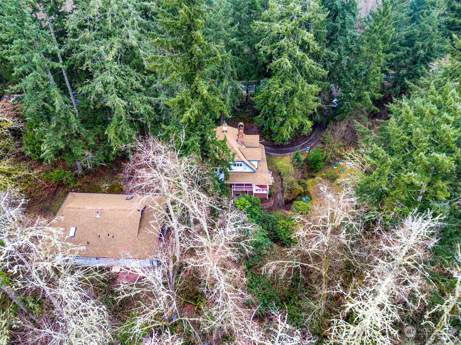 8120 Libby Road Northeast Olympia, WA 98506 - Photo 31 of 36 an aerial view of a house with a yard