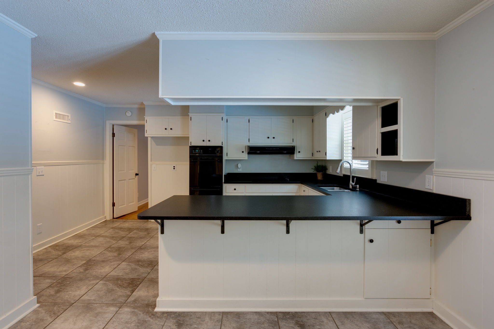3557 Forest Park Road Springfield, TN 37172 - Photo 11 of 47 a kitchen with kitchen island granite countertop a sink and a refrigerator