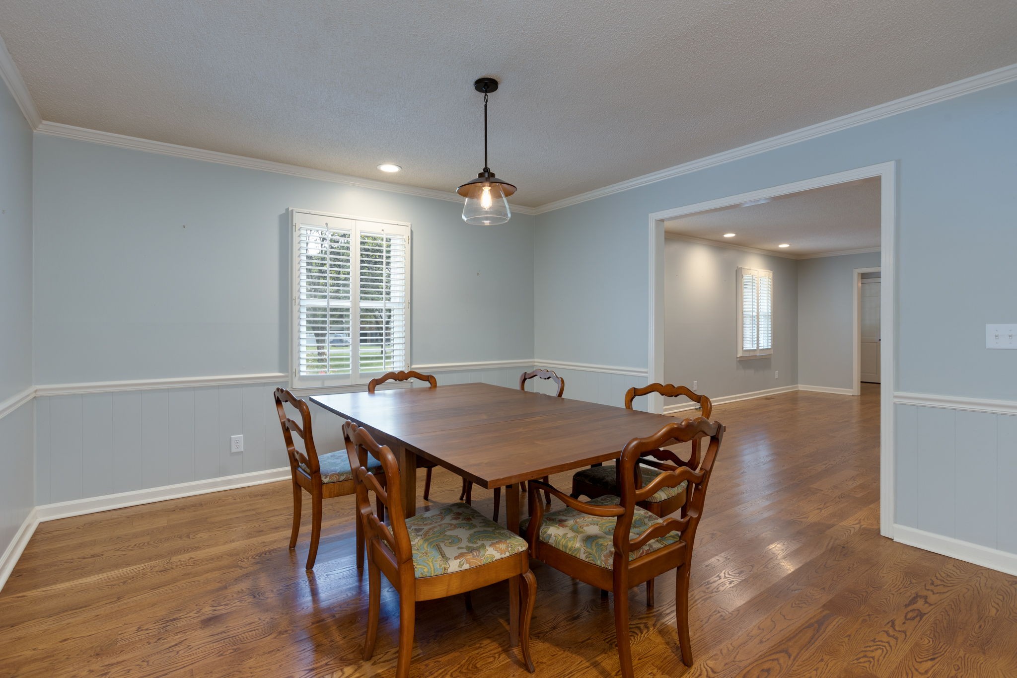 3557 Forest Park Road Springfield, TN 37172 - Photo 12 of 47 a dining room with a table chairs and wooden floor
