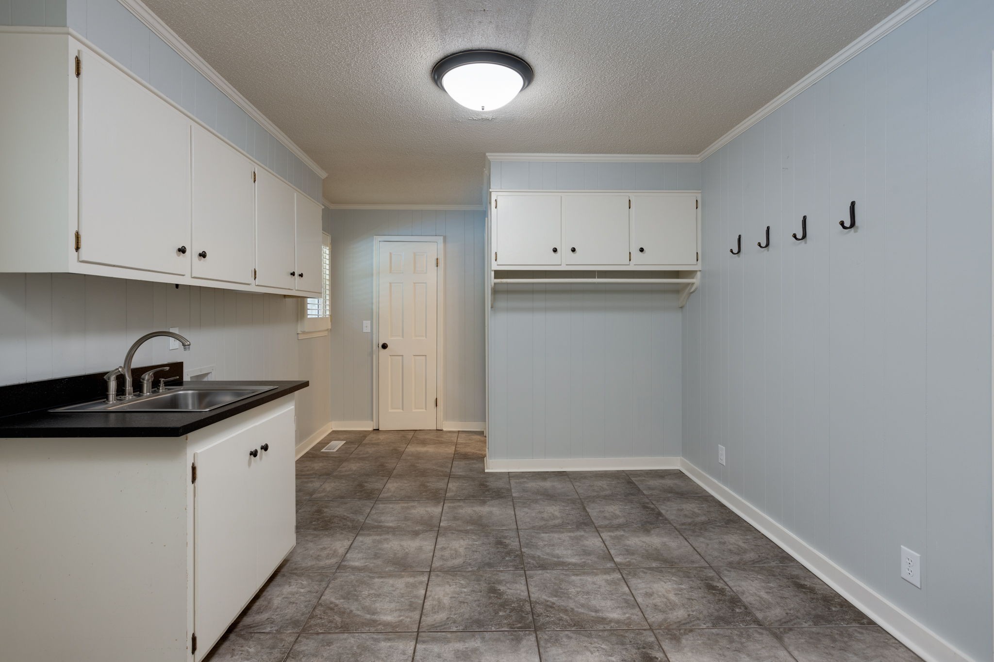 3557 Forest Park Road Springfield, TN 37172 - Photo 28 of 47 a kitchen with granite countertop a sink and cabinets