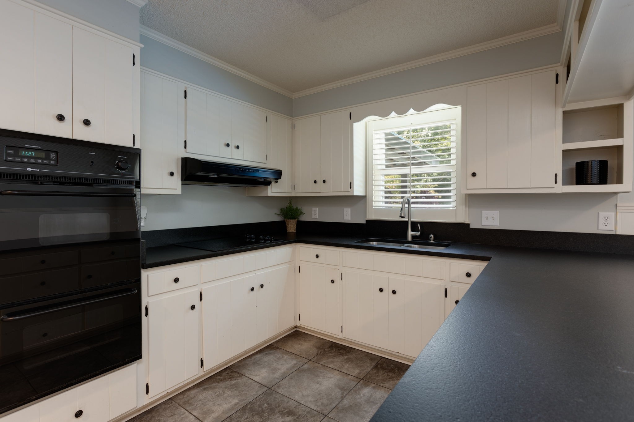 3557 Forest Park Road Springfield, TN 37172 - Photo 10 of 47 a kitchen with granite countertop white cabinets stainless steel appliances and a sink