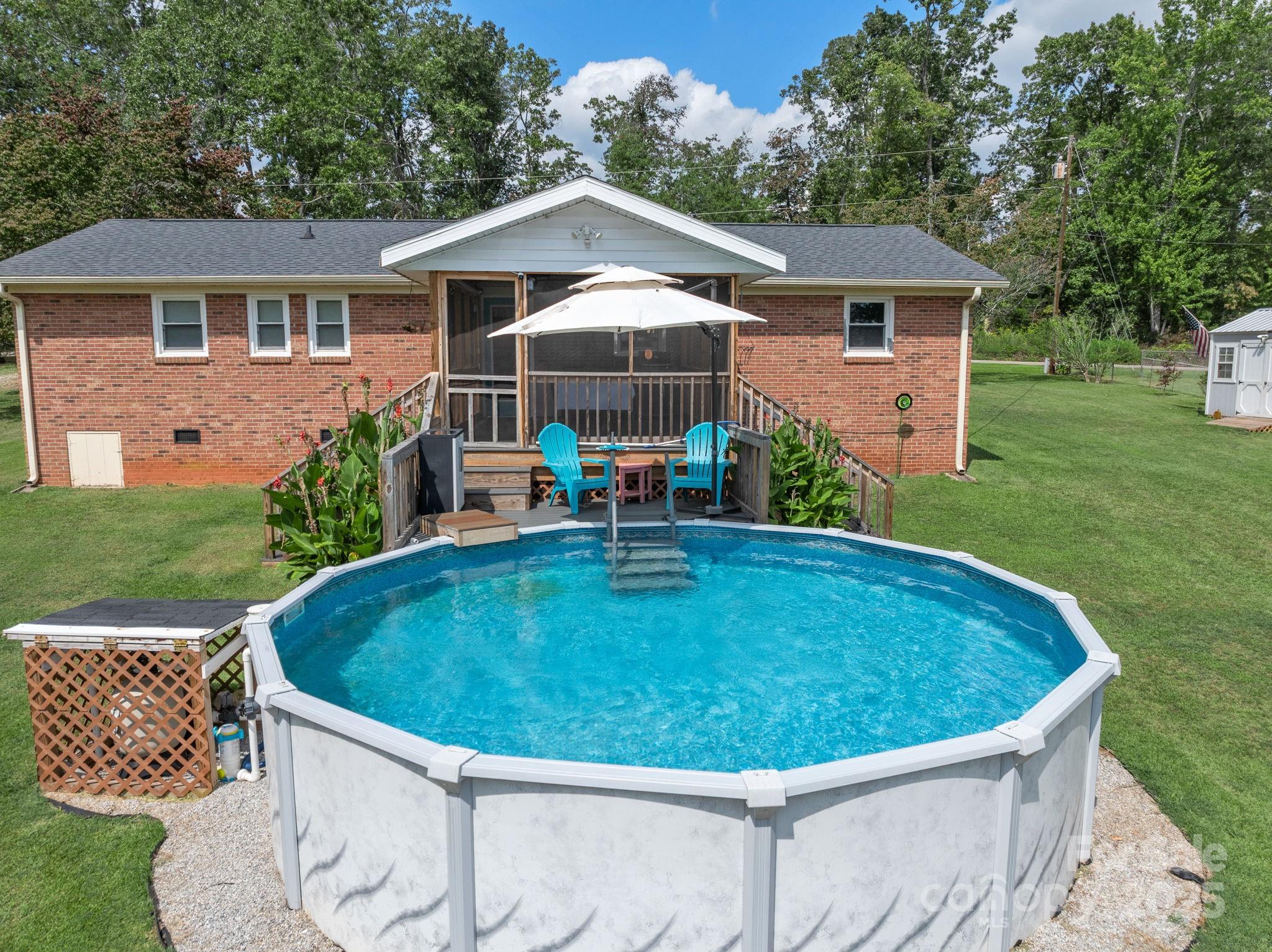 12 Lister Road Taylors, SC 29687 - Photo 33 of 37 a view of a house with pool backyard and chairs