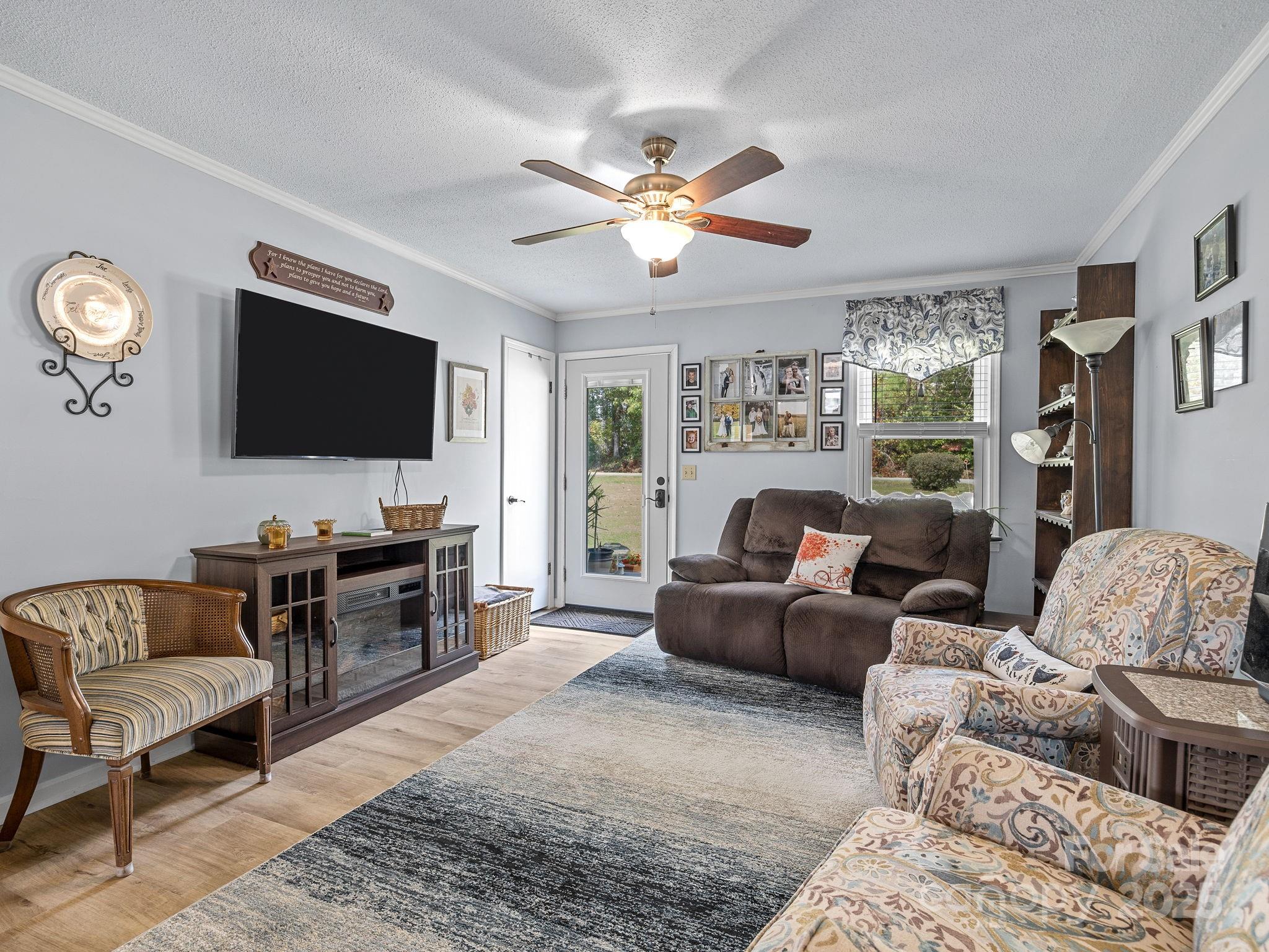 12 Lister Road Taylors, SC 29687 - Photo 8 of 37 a living room with furniture and a flat screen tv