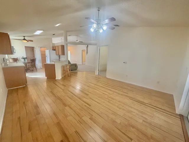 a view of kitchen and dining room with wooden floor
