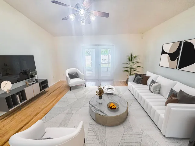 a living room with furniture and a flat screen tv