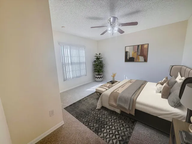 a bedroom with a bed and window