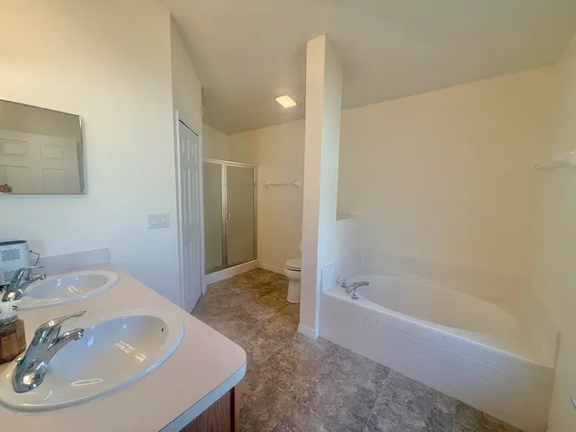 a bathroom with a bathtub and a sink