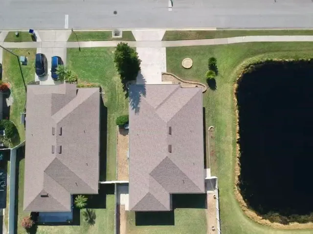 an aerial view of a house with a swimming pool
