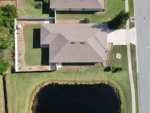 a aerial view of a house with swimming pool