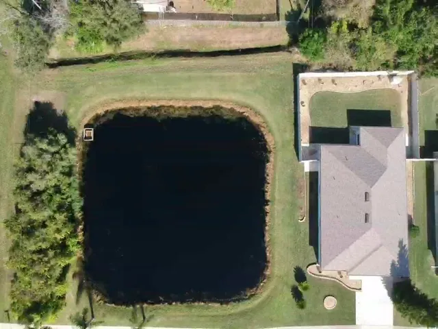 an aerial view of a house having yard
