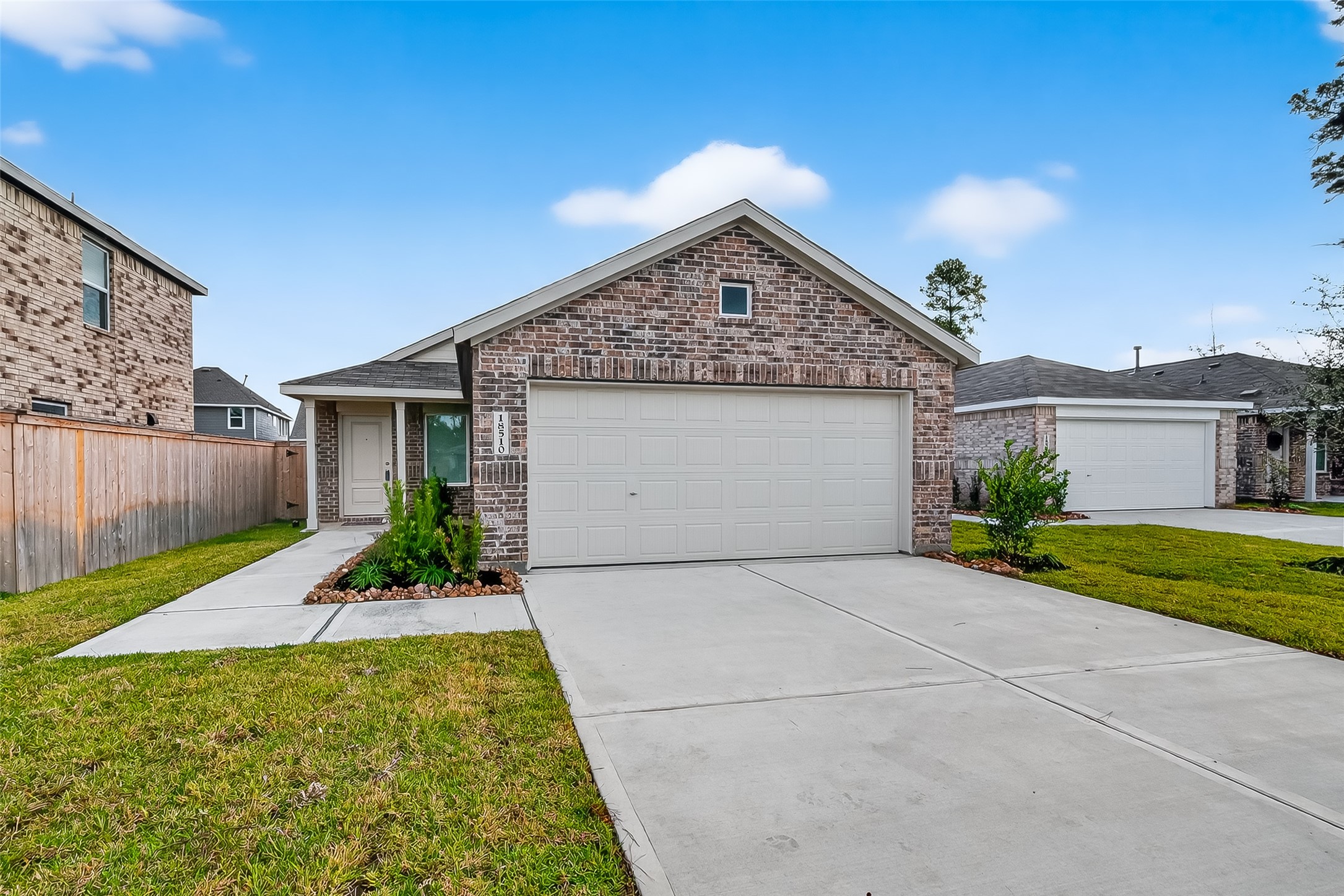 18510 Autumn Hts Lane Crosby, TX 77532 - Photo 2 of 29 a front view of a house with garden