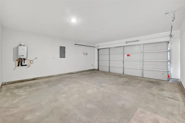 a view of a house with a yard and wooden fence