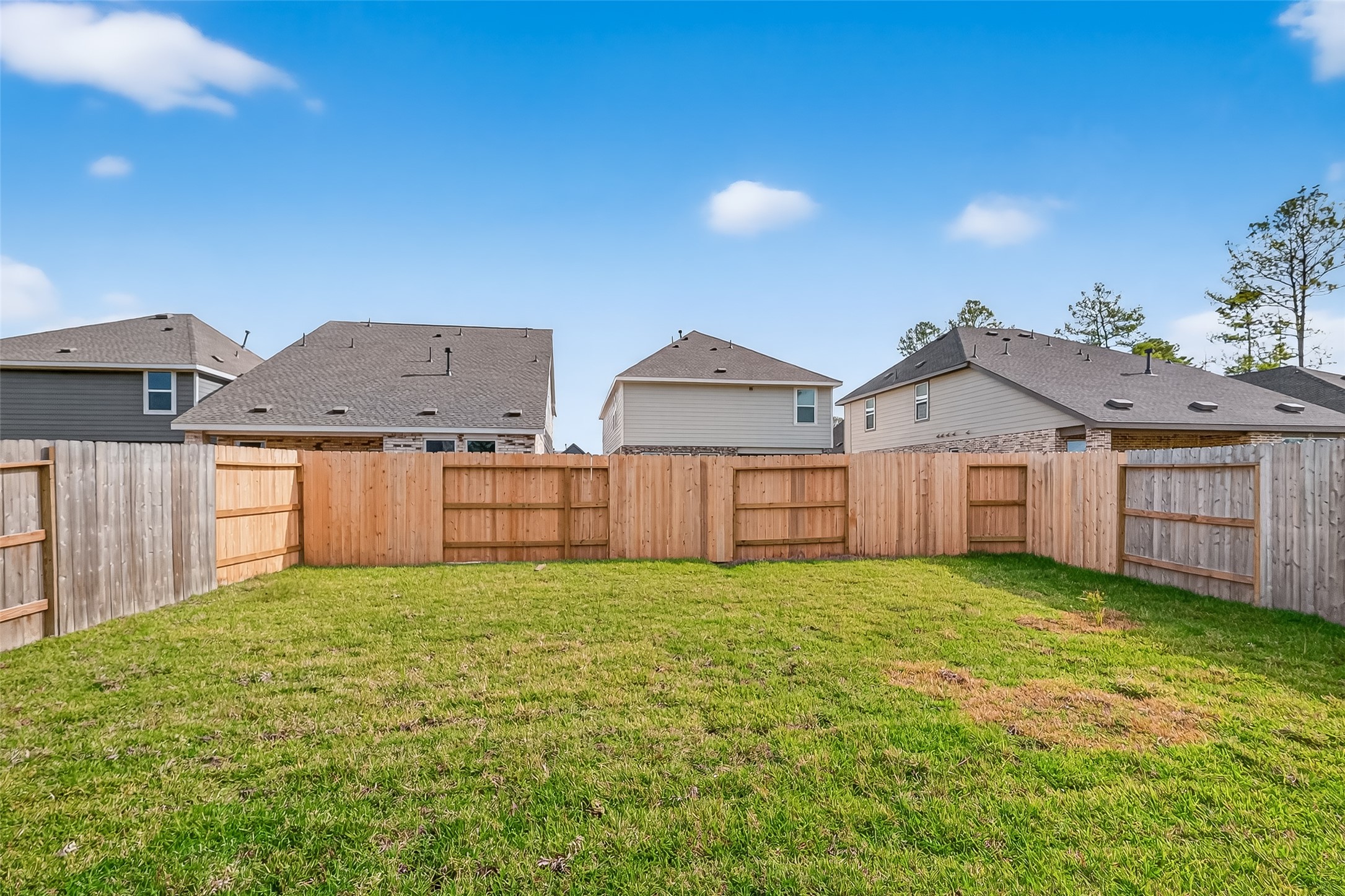 18510 Autumn Hts Lane Crosby, TX 77532 - Photo 28 of 29 a view of a house with a yard and wooden fence