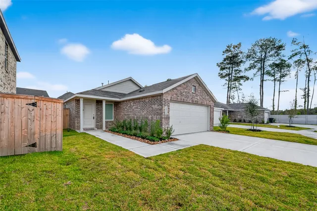 a view of a house with backyard and swimming pool