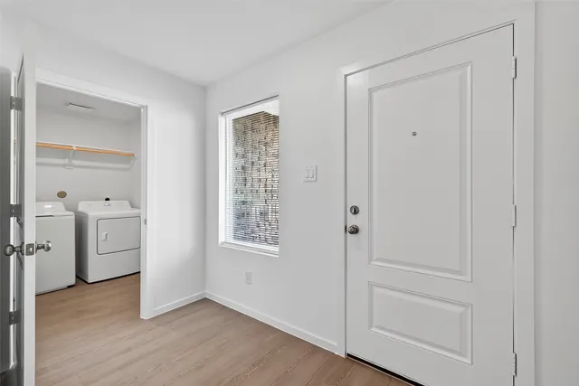 wooden floor in an empty room and a window