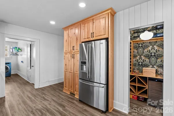 a view of wooden floor and windows in a room