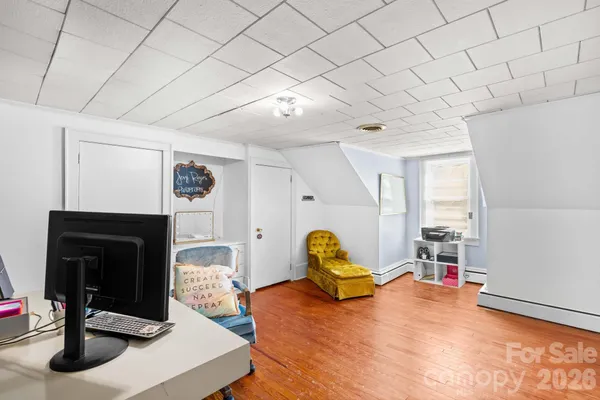 a workspace with furniture hardwood and a window