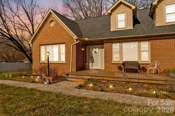 a front view of a house with yard