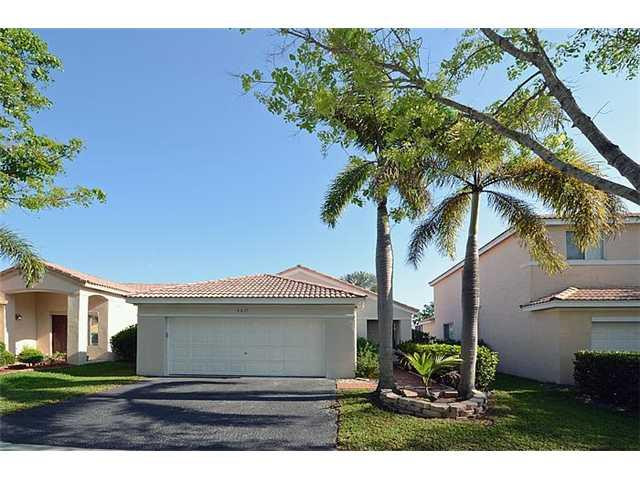4417 Magnolia Ridge Drive Weston, FL 33331 - Photo 13 of 24 a view of house with a yard