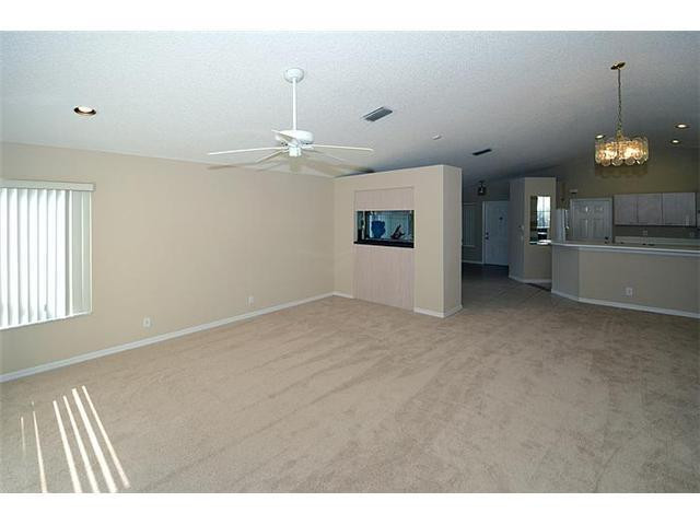 4417 Magnolia Ridge Drive Weston, FL 33331 - Photo 19 of 24 a view of a room with window and chandelier