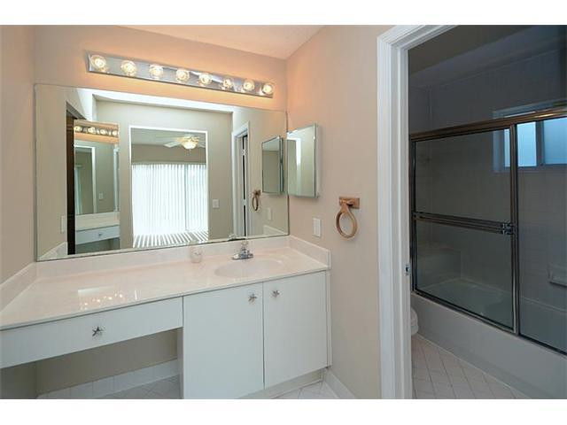 4417 Magnolia Ridge Drive Weston, FL 33331 - Photo 20 of 24 a bathroom with a shower sink and mirror