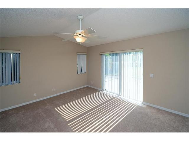 4417 Magnolia Ridge Drive Weston, FL 33331 - Photo 22 of 24 an empty room with wooden floor and windows