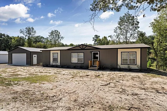 a house with yard in front of it